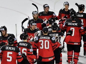 Team Canada gather after winning the Ice Hockey World Championships quarterfinal match between Canada and Germany in the LANXESS arena in Cologne, Germany on May 18, 2017. Canada and Russia are set for the latest instalment of their long-running hockey rivalry. The two teams will meet Saturday in the semifinals at the world hockey championship. Canada is the two-time defending champion at the tournament. THE CANADIAN PRESS/AP, Martin Meissner
