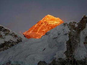 FILE - In this Nov. 12, 2015, file photo, Mt. Everest is seen from the way to Kalapatthar in Nepal. An American climber has died near the summit of Mount Everest and an Indian climber is missing after heading down from the mountain following a successful ascent, expedition organizers said Sunday. (AP Photo/Tashi Sherpa, File)