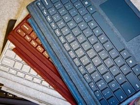 This Tuesday, May 16, 2017, photo, shows a selection of keyboards in four different colors for Microsoft&#039;s new Surface Pro laptop-tablet hybrid, on display in New York. (AP Photo/Bebeto Matthews)