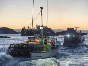 Lobster boats head from West Dover, N.S. on Tuesday, Nov. 29, 2016 as the lobster season on Nova Scotia&#039;s South Shore opens. A lengthy RCMP investigation into allegations of fraud and theft involving more than $3 million worth of lobster has led to charges against three Nova Scotia men. THE CANADIAN PRESS/Andrew Vaughan