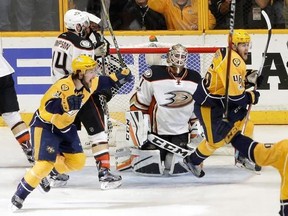 Anaheim Ducks goalie Jonathan Bernier kneels on the ice as Nashville Predators&#039; Filip Forsberg (9), of Sweden, and Pontus Aberg (46), of Sweden, celebrate a goal by teammate Colton Sissons, not shown, during the third period in Game 6 of the Western Conference final in the NHL hockey Stanley Cup playoffs Monday, May 22, 2017, in Nashville, Tenn. Sissons had a hat trick as the Predators won 6-3 to win the series 4-2 and advance to the Stanley Cup Finals. (AP Photo/Mark Humphrey)