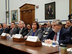 FILE - In this Tuesday, May 2, 2017, file photo, American Airlines Senior Vice President of Customer Experience Kerry Philipovitch, second from right, testifies on Capitol Hill in Washington, before a House Transportation Committee oversight hearing. From left are: United Airlines CEO Oscar Munoz; United Airlines President Scott Kirby; Joseph Sprague, senior vice president of external relations, Alaska Airlines; Bob Jordan, executive vice president and chief commercial officer, Southwest Airline