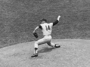 FILE - In this June 21, 1964, file photo, Jim Bunning of the Philadelphia Phillies pitches a perfect game against the New York Mets at Shea Stadium in New York. Hall of Fame pitcher Bunning, who went on to serve in Congress, has died. Bunning&#039;s death Friday, May 26, 2017, was confirmed by Jon Deuser, who served as chief of staff when Bunning was in the Senate. (AP Photo/File)