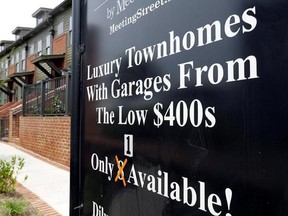 FILE - This Thursday, April 27, 2017, file photo shows a sign promoting town homes for sale, in Charlotte, N.C. U.S. home prices climbed in March 2017 at the strongest rate in nearly three years as a dwindling supply of houses for sale is causing prices to significantly outpace income growth. (AP Photo/Chuck Burton, File)