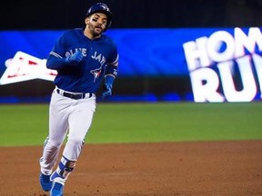 Toronto Blue Jays second baseman Devon Travis (29) rounds the bases after hitting a two-run homer during seventh inning interleague baseball action in Toronto on Wednesday, May 31, 2017.