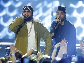 The Weeknd, right, and Belly perform during the 2016 Juno Awards in Calgary.