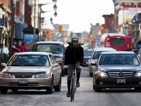 A cyclist travels along Bank Street in downtown Ottawa. Wednesday January 5,2011. (ERROL MCGIHON/THE OTTAWA SUN)
