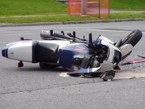 A man went to hospital with critical injuries after his motorcycle and a car collided just after 3 p.m. Saturday, Aug. 28 on Fisher Ave. between Baseline Rd. and Meadlowlands Dr. in south Ottawa. Scott Taylor/Ottawa Sun ORG XMIT: OttCrashpicAug300