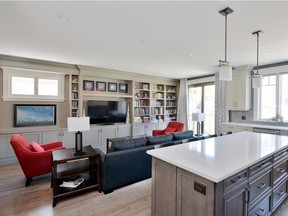 Squaring off the back of the home and reallocating spaces on the main floor gave the homeowners a huge open concept living space, with an adjacent family room.