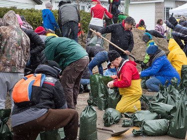 All sorts of volunteers are pitching in with sandbagging at Rue Saint-Louis and Rue Moreau in Gatineau as flooding continues throughout the region in areas along the local rivers.