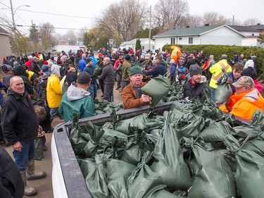 All sorts of volunteers are pitching in with sandbagging at Rue Saint-Louis and Rue Moreau in Gatineau as flooding continues throughout the region in areas along the local rivers.