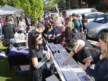 Bargain hunters look for deals at the Great Glebe Garage Sale on Saturday, May 27, 2017.