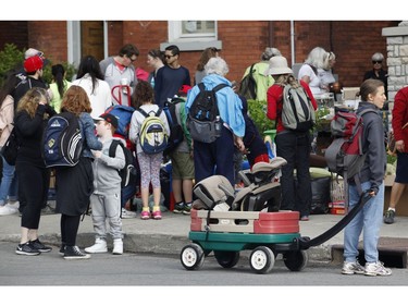 Bargain hunters look for deals at the Great Glebe Garage Sale on Saturday, May 27, 2017.