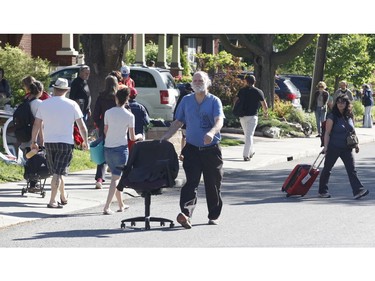 Bargain hunters look for deals at the Great Glebe Garage Sale on Saturday, May 27, 2017.