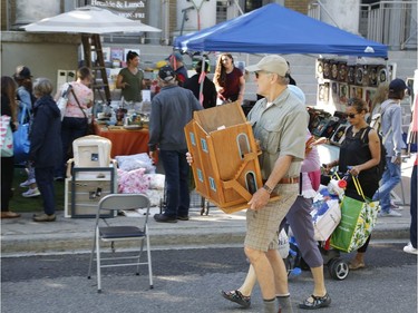 Bargain hunters look for deals at the Great Glebe Garage Sale on Saturday, May 27, 2017.