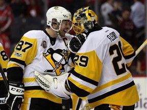 Sidney Crosby #87 and goalie Marc-Andre Fleury #29 of the Pittsburgh Penguins celebrate following the Penguins 2-0 win over the Washington Capitals in Game Seven of the Eastern Conference Second Round during the 2017 NHL Stanley Cup Playoffs at Verizon Center on May 10, 2017 in Washington, DC.