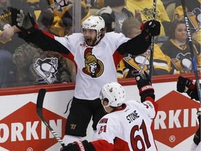 Ottawa Senators' Bobby Ryan, left, celebrates with teammates Mark Stone and Jean-Gabriel Pageau after scoring the game-winning goal against the Pittsburgh Penguins during the overtime period of Game 1 on May 13, 2017, in Pittsburgh. Ottawa won 2-1 in overtime.