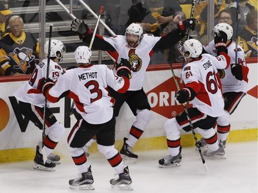 The Ottawa Senators' Bobby Ryan celebrates with teammates after scoring his dramatic Game 1 overtime goal.