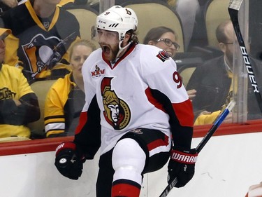 Ottawa Senators' Bobby Ryan skates past Pittsburgh Penguins fans as he celebrates scoring a game-winning goal in overtime.