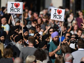 Armed police gather at Manchester Arena after reports of an explosion at the venue during an Ariana Grande gig in Manchester, England Monday, May 22, 2017. Twenty-two are dead and dozens more injured in the worst terrorist attack in Britain in more than a decade. (Peter Byrne/PA via AP