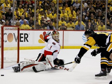 Ottawa Senators goalie Mike Condon makes a save on Pittsburgh Penguins' Bryan Rust (17) during the second period of Game 5 in the NHL hockey Stanley Cup Eastern Conference finals, Sunday, May 21, 2017, in Pittsburgh.