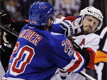New York Rangers' Chris Kreider (20) and Ottawa Senators' Dion Phaneuf (2) fight during the second period of Game 4 of an NHL hockey Stanley Cup second-round playoff series Thursday, May 4, 2017, in New York.