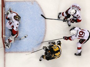 Pittsburgh Penguins' Chris Kunitz (14) puts a shot past Ottawa Senators goalie Craig Anderson (41) for a goal during the second period of Game 7 of the Eastern Conference final in the NHL Stanley Cup hockey playoffs in Pittsburgh, Thursday, May 25, 2017.