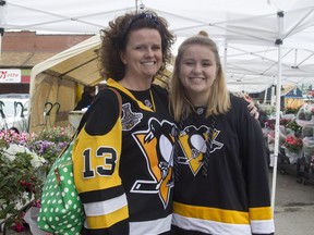 Chrissy Kyak and her daughter, Kate, are superstitious fans (with a dog named Crosby) and so won't voice their opinions about how many games the Sens/Pens series will last. (Bruce Deachman, Ottawa Citizen)