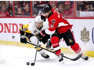 Clarke MacArthur and Olli Maatta chase the puck in the third period.