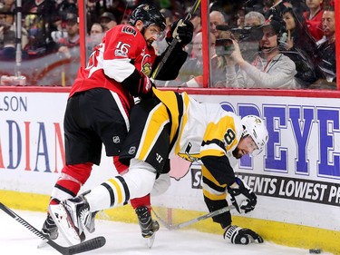 The Senators' Clarke MacArthur checks the Penguins' Brian Dumoulin during the first period of Game 4 at the Canadian Tire Centre on Friday, May 19, 2017.