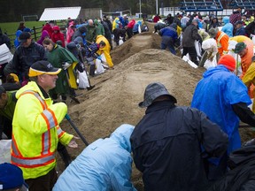 Constance and Buckham's Bay Community Centre was filled with volunteers filling sandbags Saturday morning.
