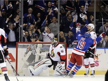 Ottawa Senators goalie Craig Anderson (41) and New York Rangers' Jesper Fast (19) react after Nick Holden (22) scored a goal during the first period of Game 4 of an NHL hockey Stanley Cup second-round playoff series Thursday, May 4, 2017, in New York.