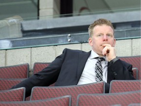 Daniel Alfredsson of the Ottawa Senators follows the team's practice from the seating area at Canadian Tire Centre on May 12.