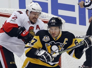The Ottawa Senators' Dion Phaneuf checks the Pittsburgh Penguins' Sidney Crosby in the crease during the first period of Game 1 of the Eastern Conference final on Saturday, May 13, 2017, in Pittsburgh.