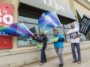 Employees picket in front of the LCBO store on Innes Road last month.
