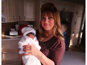 Erica Fleming and her newborn daughter, Tilania Victoria Bou-Rjeili. A pregnant Fleming had to evacuate her Cumberland home during the flooding but was able to return after giving birth.