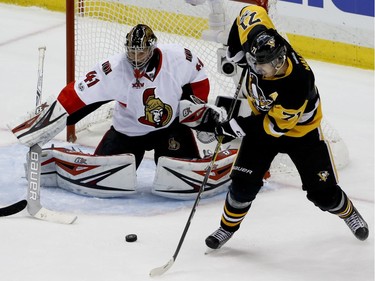 Pittsburgh Penguins' Evgeni Malkin shoots and scores on Ottawa Senators goalie Craig Anderson during the third period of Game 1.