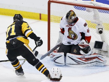 Ottawa Senators goalie Craig Anderson (41) stops a shot by Pittsburgh Penguins' Evgeni Malkin (71) during the first period of Game 2 of the Eastern Conference final in the NHL hockey Stanley Cup playoffs, Monday, May 15, 2017, in Pittsburgh.