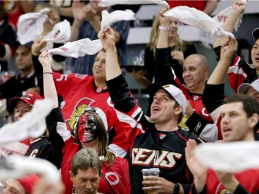 Fans celebrate in the first period as the Ottawa Senators take on the Pittsburgh Penguins in Game 3 of the NHL Eastern Conference Finals at the Canadian Tire Centre.  Wayne Cuddington/Postmedia