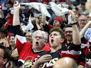 Fans celebrate in the first period as the Ottawa Senators take on the Pittsburgh Penguins in Game 3 of the NHL Eastern Conference Finals at the Canadian Tire Centre.  Wayne Cuddington/Postmedia