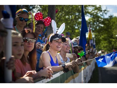 Fans, including Kathleen Ferland in the bunny ears, lined Queen Elizabeth Drive to cheer on runners during the 5k race.