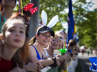 Fans, including Kathleen Ferland in the bunny ears, lined Queen Elizabeth Drive to cheer on runners during the 5k race.