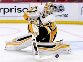 Penguins goalie Matthew Murray clears the puck in the first period of Game 4.