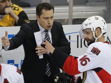 Ottawa Senators head coach Guy Boucher talks with Clarke MacArthur during a break in the action during the third period.