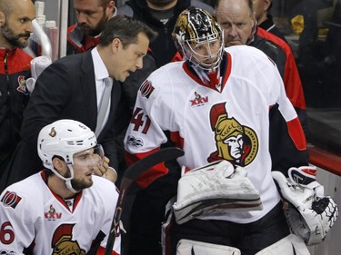 Ottawa Senators head coach Guy Boucher, left, talks with goalie Craig Anderson on the bench during the first period of Game 5 in Pittsburgh, Sunday, May 21, 2017.