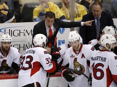 Ottawa Senators head coach Guy Boucher directs his team during overtime of Game 7 of the Eastern Conference final against the Pittsburgh Penguins in the NHL Stanley Cup hockey playoffs in Pittsburgh, Thursday, May 25, 2017.