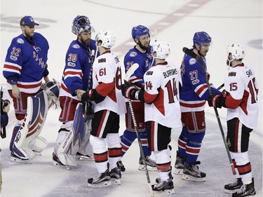 New York Rangers' Antti Raanta (32), Henrik Lundqvist (30), Derek Stepan (21) and Ryan McDonagh (27) shake hands with Mark Stone (61), Alex Burrows (14) and Zack Smith (15) after Game 6 of an NHL hockey Stanley Cup second-round playoff series Tuesday, May 9, 2017, in New York. The Senators won 4-2.