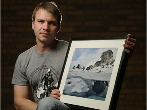 Ottawa photographer and alpinist Ivan Petrov with a photograph of Snowpatch Spire in Bugaboo Provincial Park, B.C.