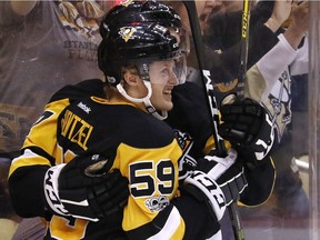 The Pittsburgh Penguins' Jake Guentzel is congratulated after scoring against the Washington Capitals in Round 2.