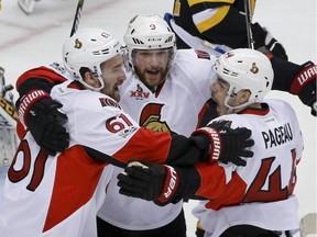 Mark Stone, Bobby Ryan and Jean-Gabriel Pageau celebrate Pageau's first-period goal.